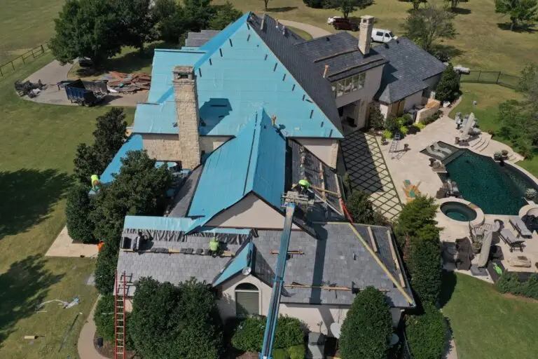 Roof renovation in progress on mansion