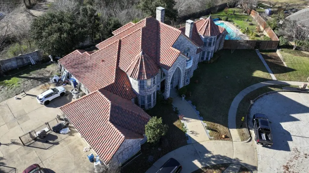 Damaged tile roof edge before repairs in Dallas–Fort Worth home