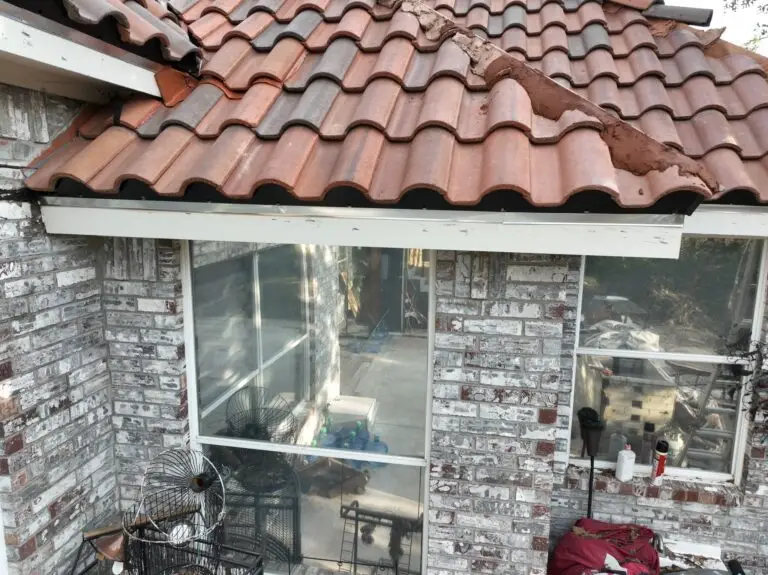 Roof tiles being reset after edge repair by Shepherd Tile Roofing