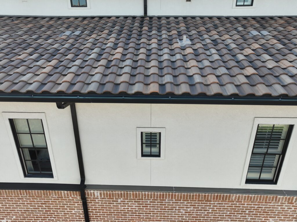 Close-up view of clay Spanish tile roof with classic curved barrel design - What Makes Spanish Tile Roofs Unique?